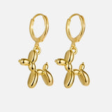 Boucles d'oreilles Huggie en or avec charme de chien ballon miniature