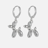 Boucles d'oreilles Huggie en or avec charme de chien ballon miniature