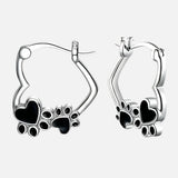Boucles d'oreilles Huggie en forme de patte de cœur avec émail noir