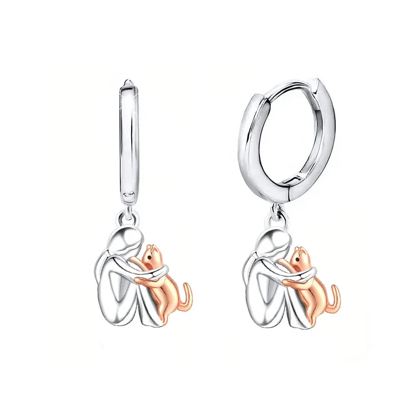Boucles d'oreilles en argent et or bicolore représentant un câlin de chat